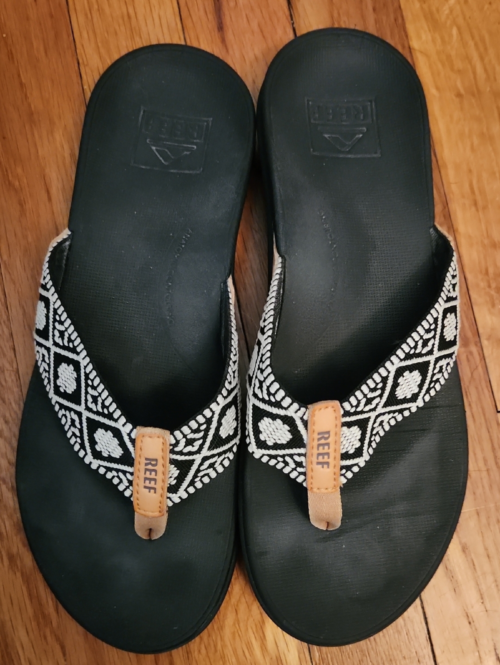 Reef Women's Black & White Pattern Strap Flip Flops with Tan Accent
